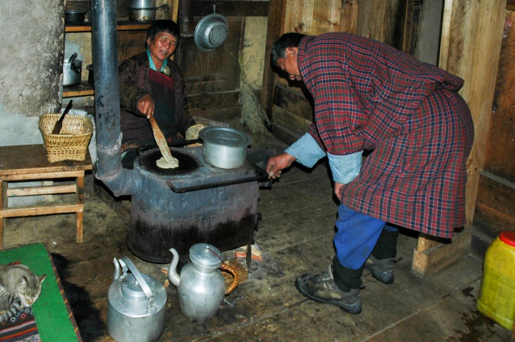 Making kule pancake with buckwheat flour, a speciality of Bumthang